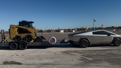Tesla Cybertruck towing a skid steer on Grace and Grit car hauler trailer
